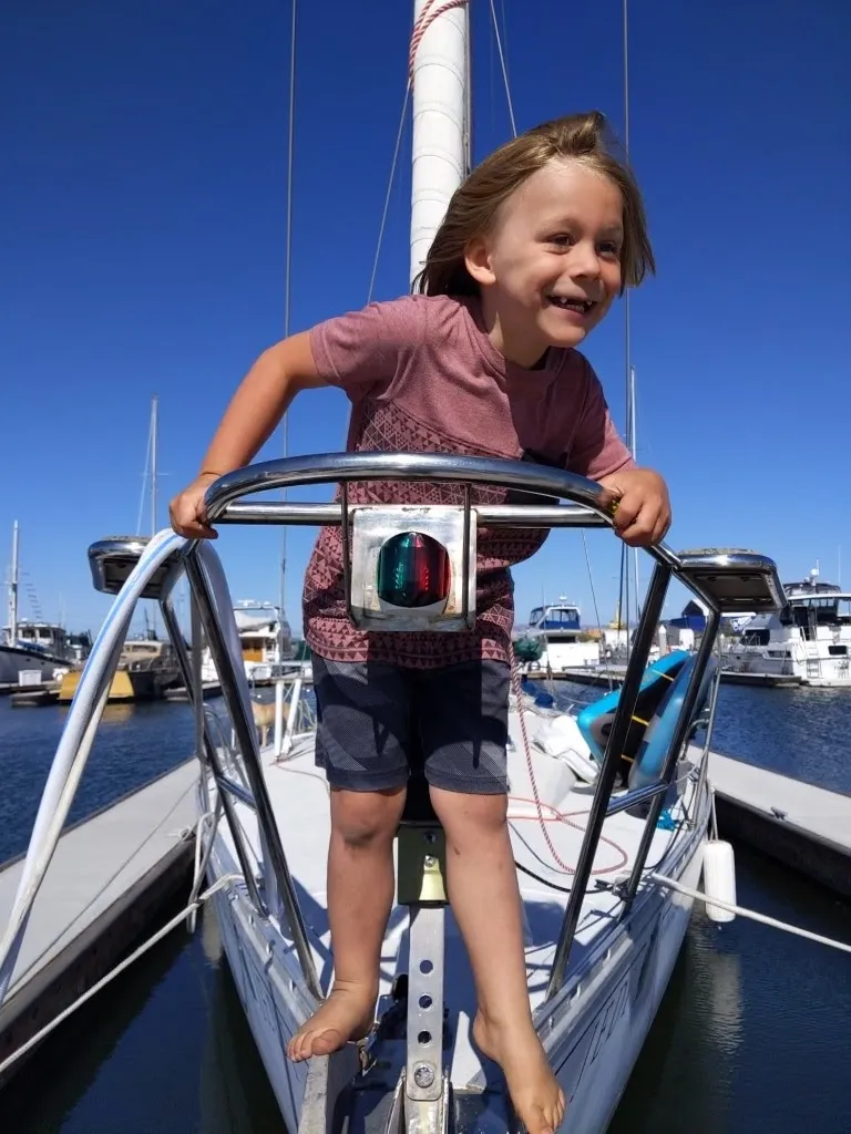 Henley smiling at the bow pulpit.