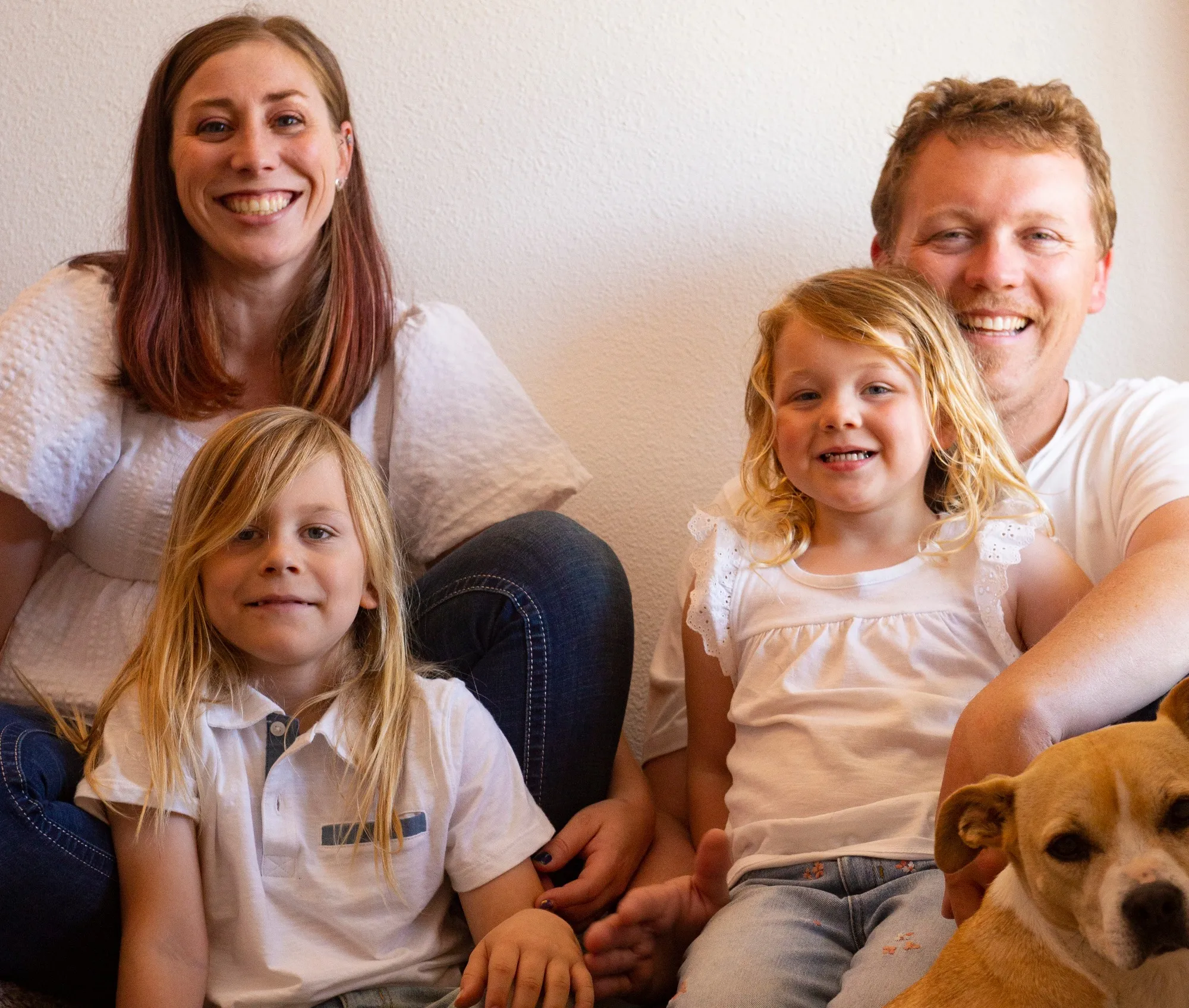 Alicia, Henley, Eloise, Bryan and Rosie smiling for a family portrait